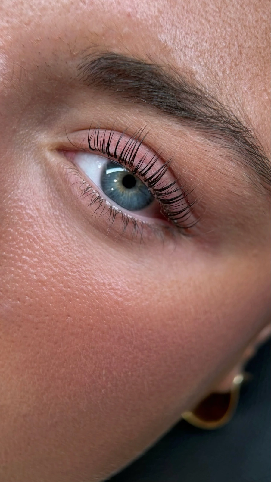 Close-up of a Lash Inspire client’s lifted lashes and defined brow
